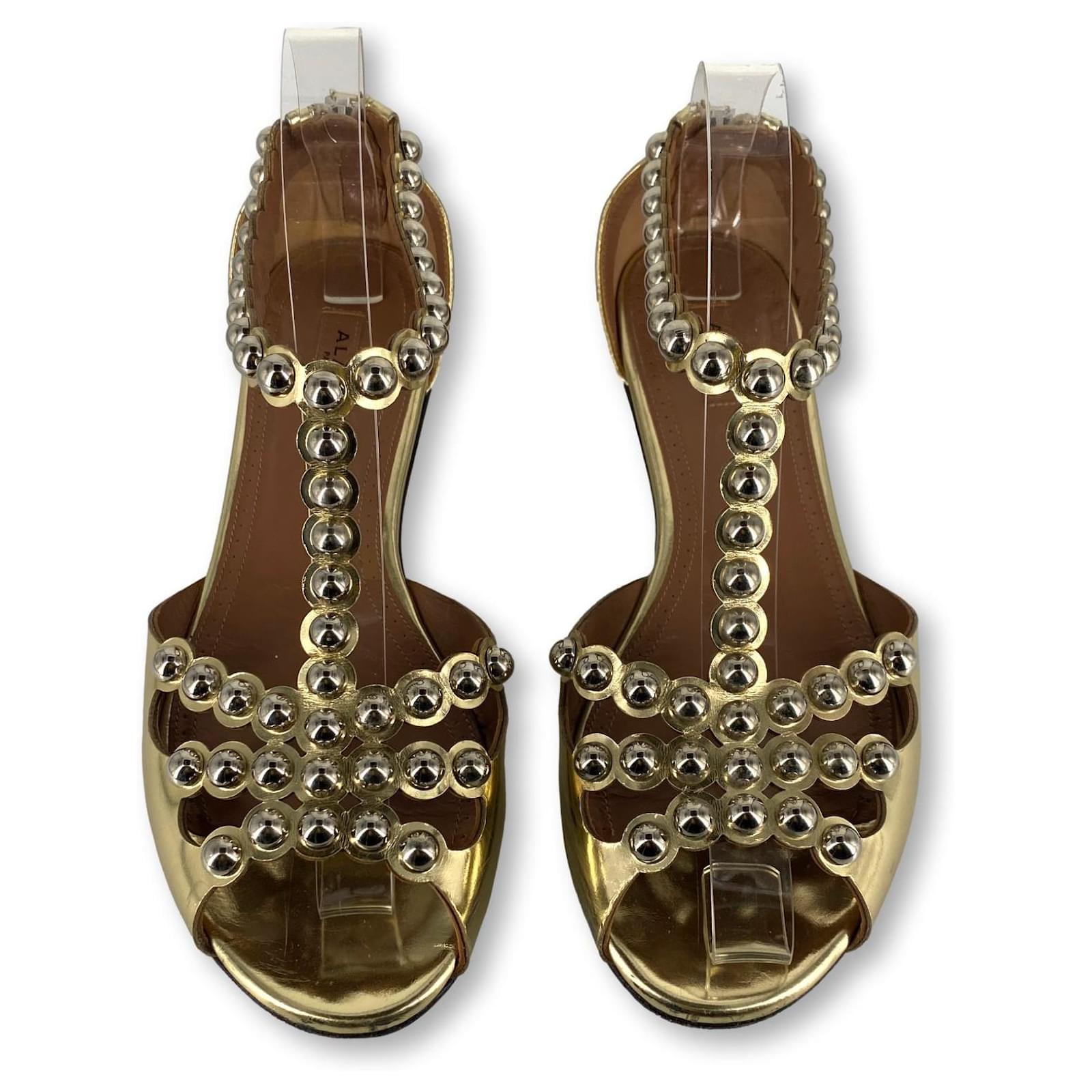 Alaïa flat metallic sandals Golden Gold hardware Leather  ref.2211299